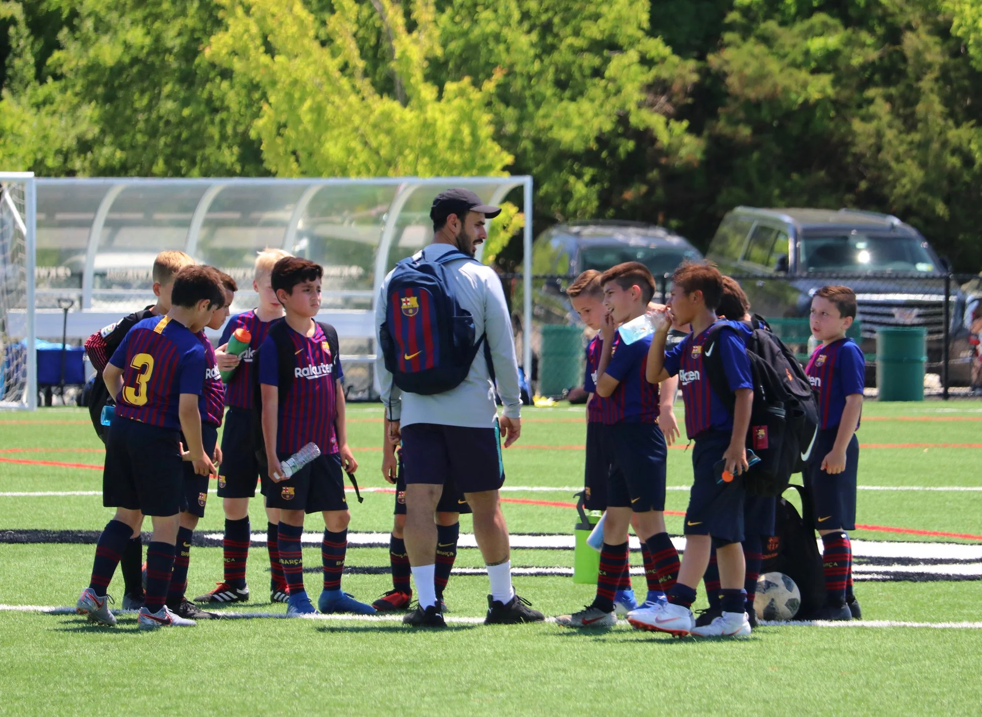 Nico Serolini coaching a group of soccer players during training