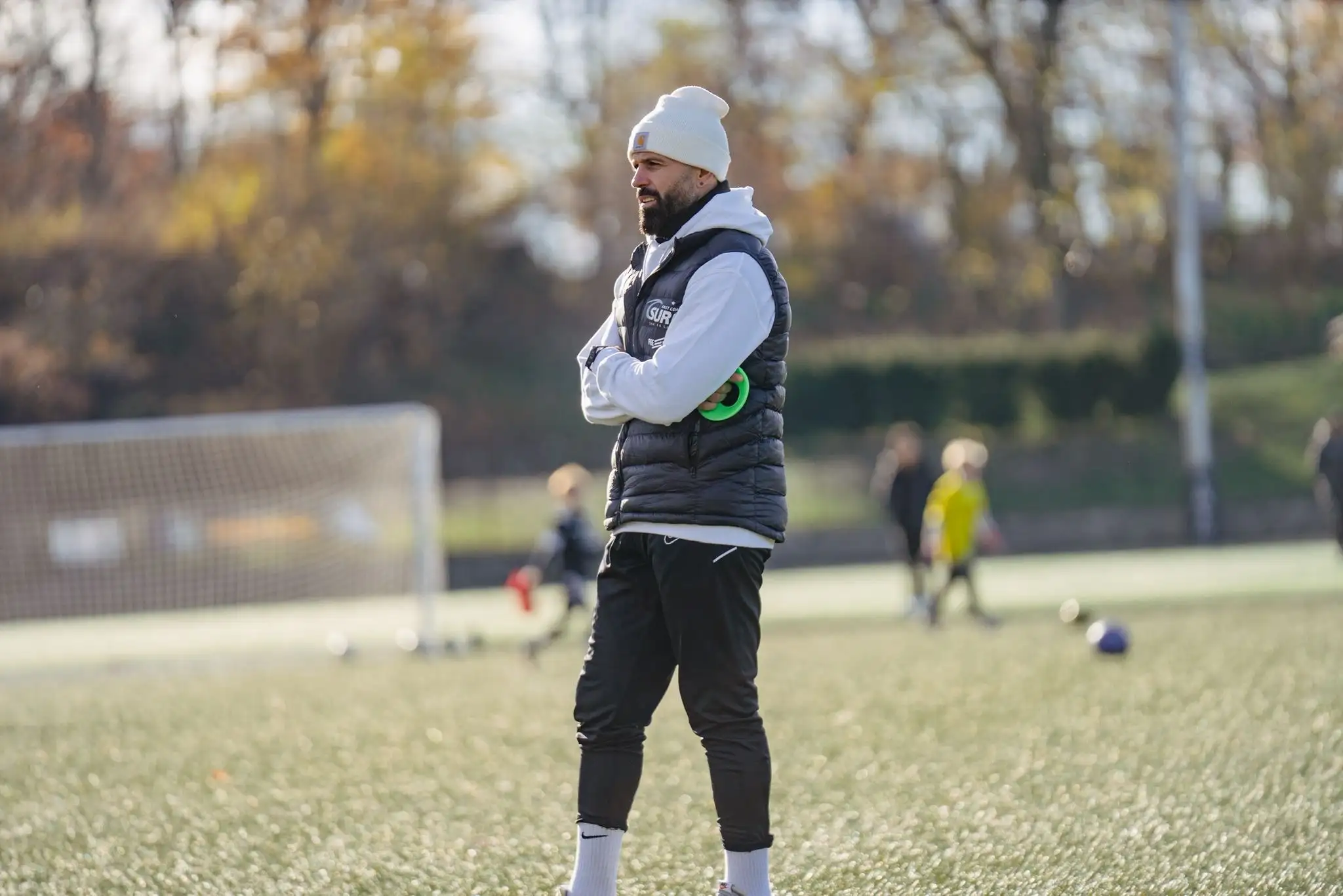 Soccer coach reviewing tactical decisions and player development at Next Play Soccer