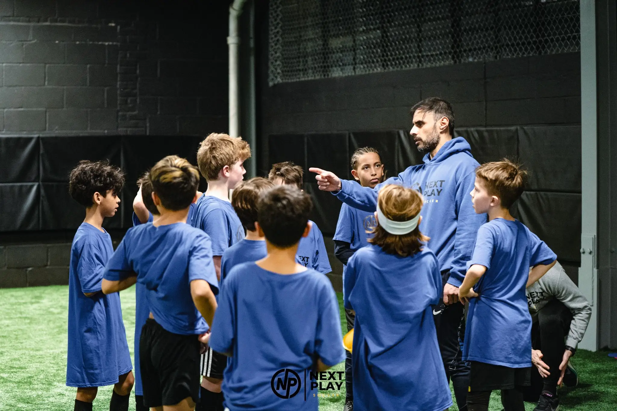 Youth soccer player practicing shooting during Long Island training